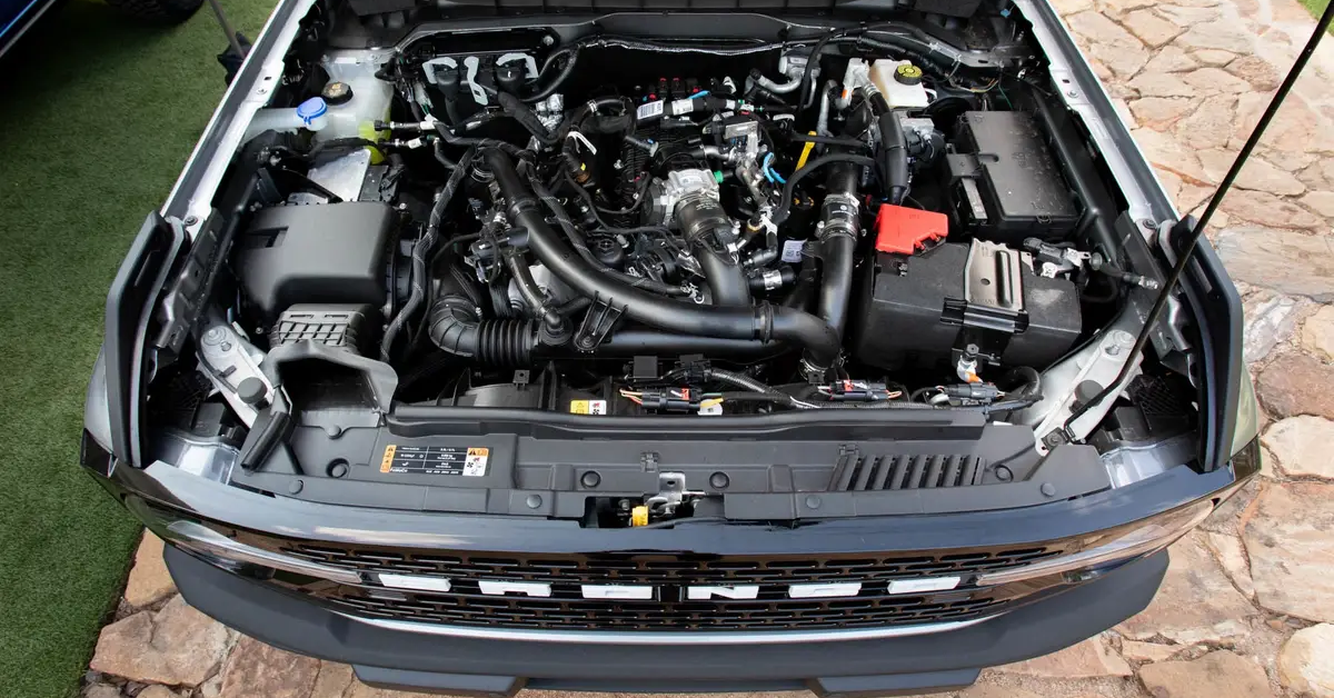 Picture of Ford Bronco with hood open showing under the hood components clearly visible