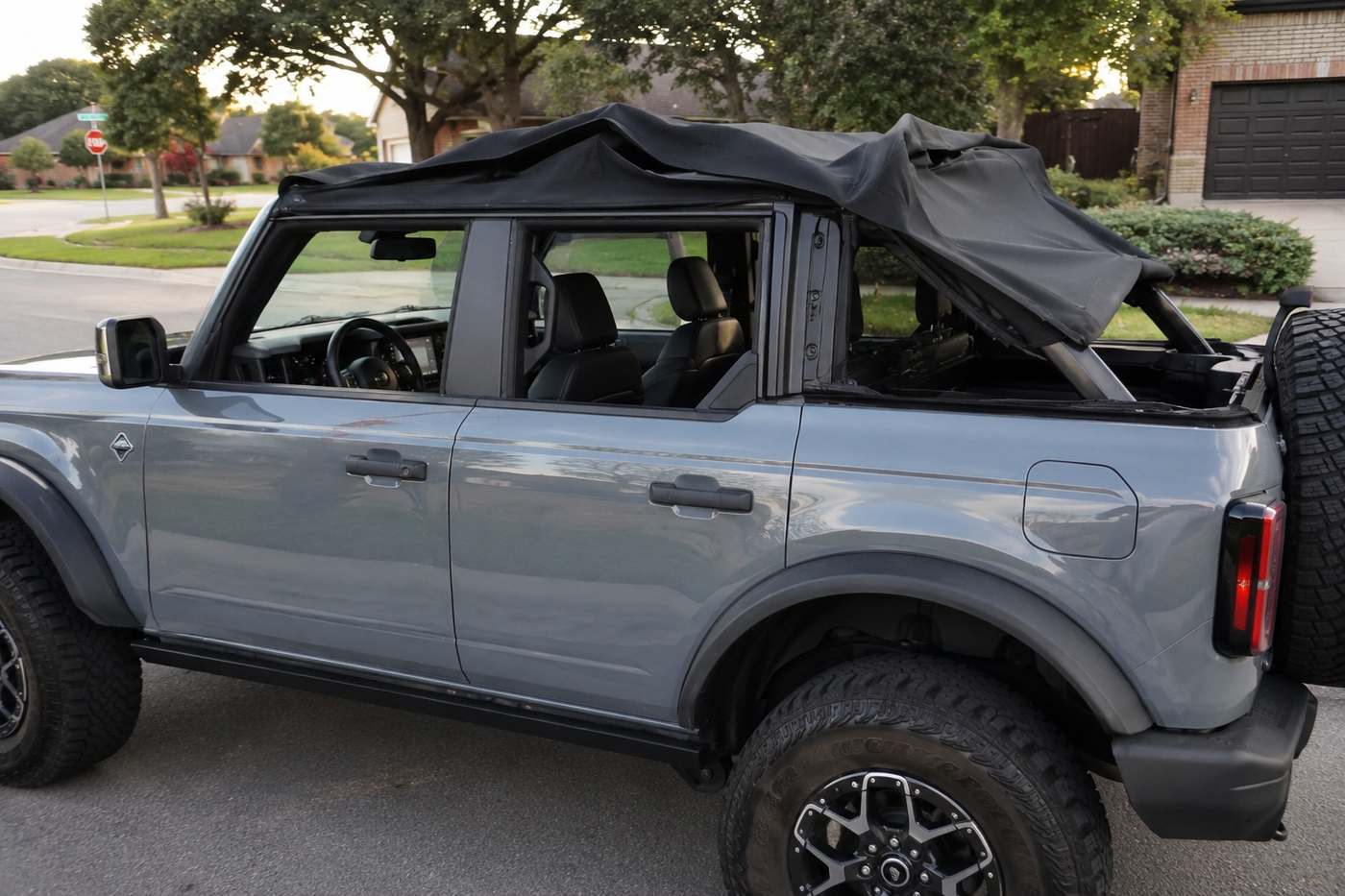 Picture of a Ford Bronco with a broken soft top