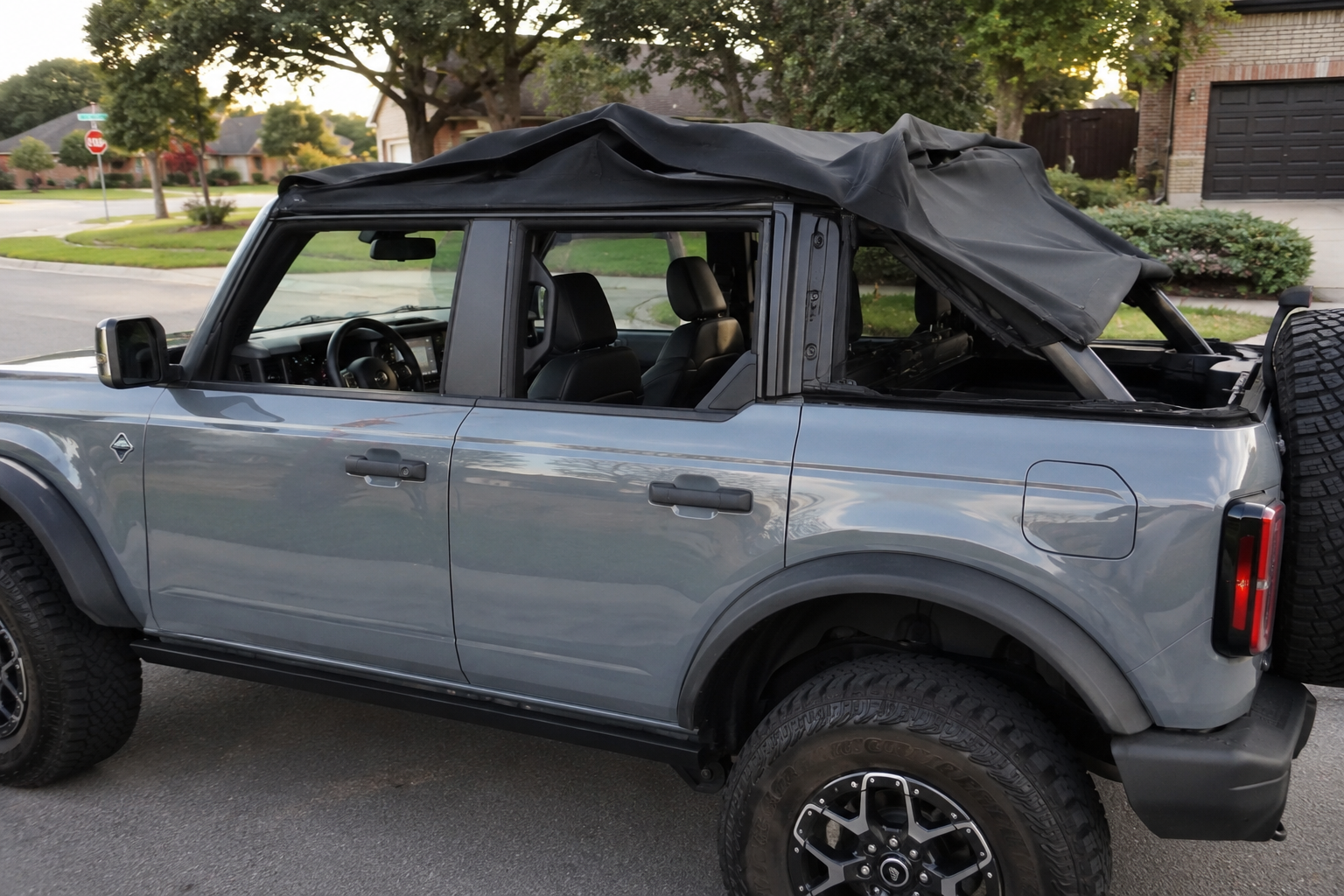 Picture of a Ford Bronco with a broken soft top