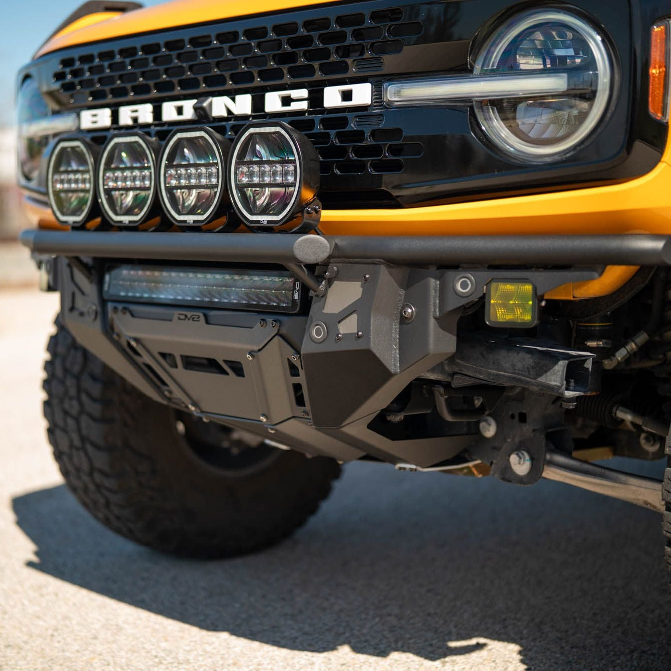 DV8 Offroad FBBR-08 Tube Series front bumper installed on yellow Ford Bronco Badlands – front view