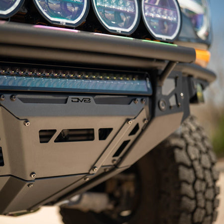 DV8 Offroad FBBR-08 Tube Series front bumper installed on yellow Ford Bronco – close-up light mounts