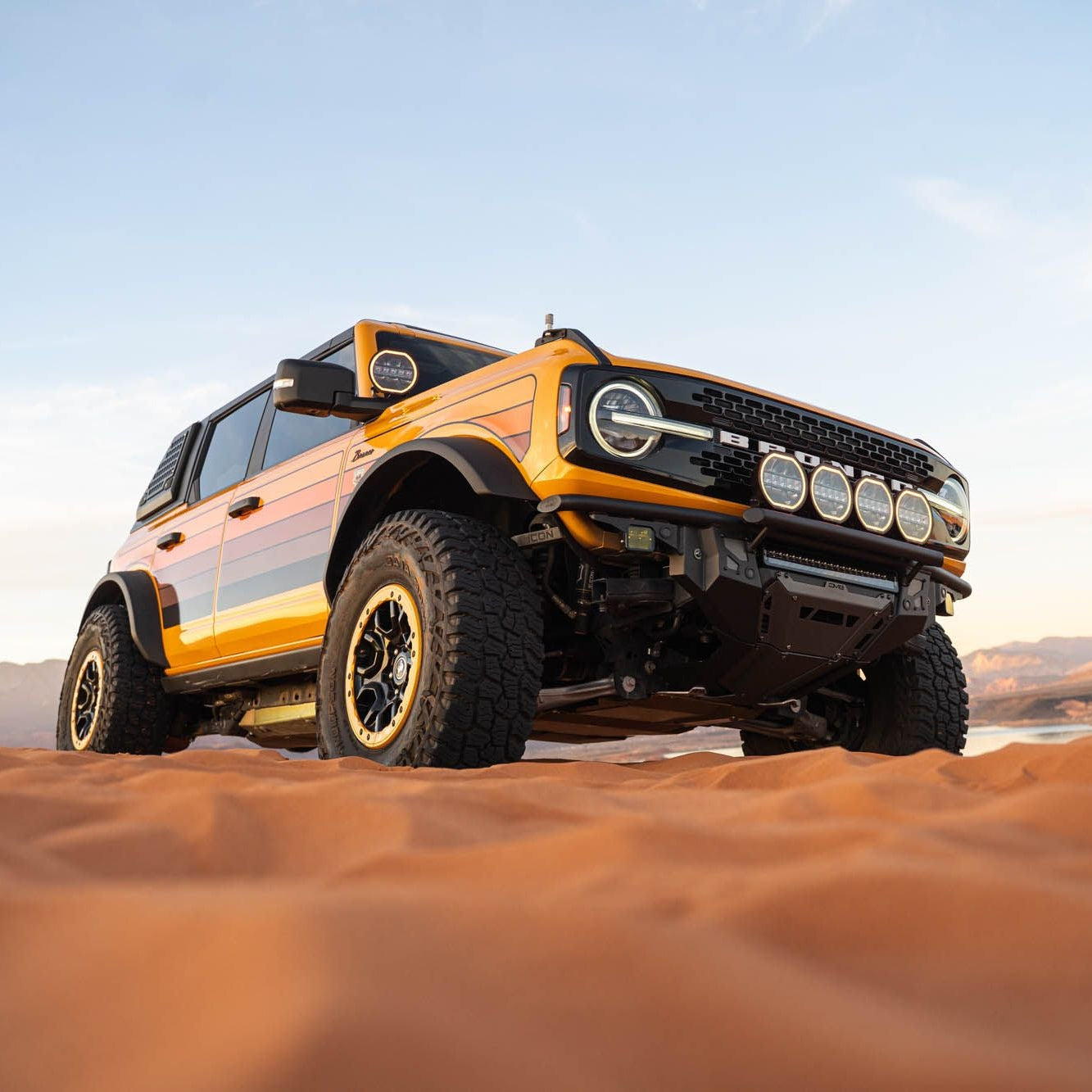 DV8 Offroad FBBR-08 Tube Series front bumper installed on white Ford Bronco – desert trail front view