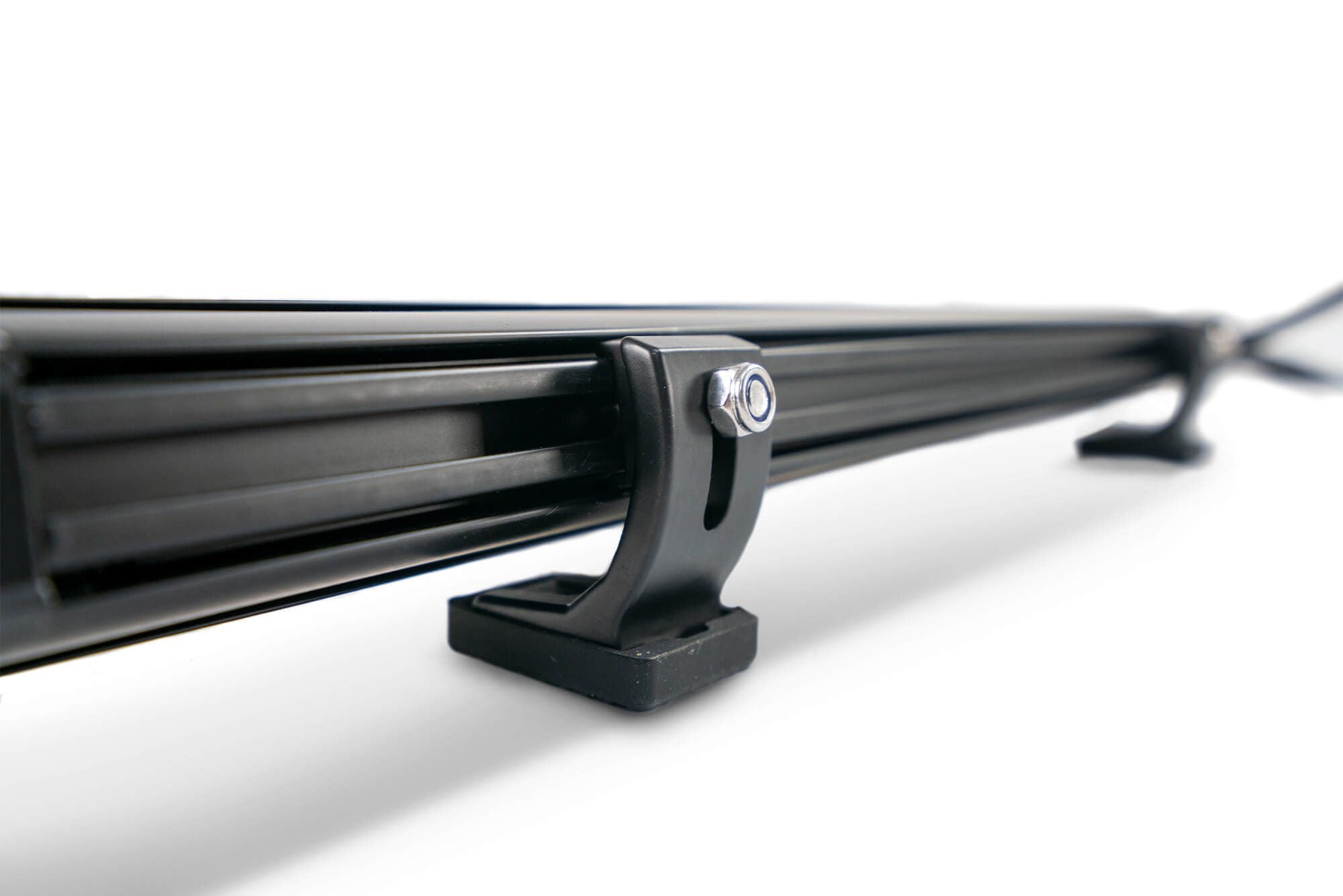 DV8 Offroad small elite series LED light bar mount close-up product shot showing rubber feet and rear slide adjustment mechanism