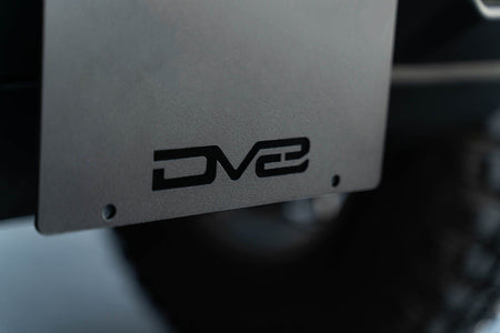 DV8 Offroad license plate mount close-up detail showing DV8 logo cutout on plate bracket