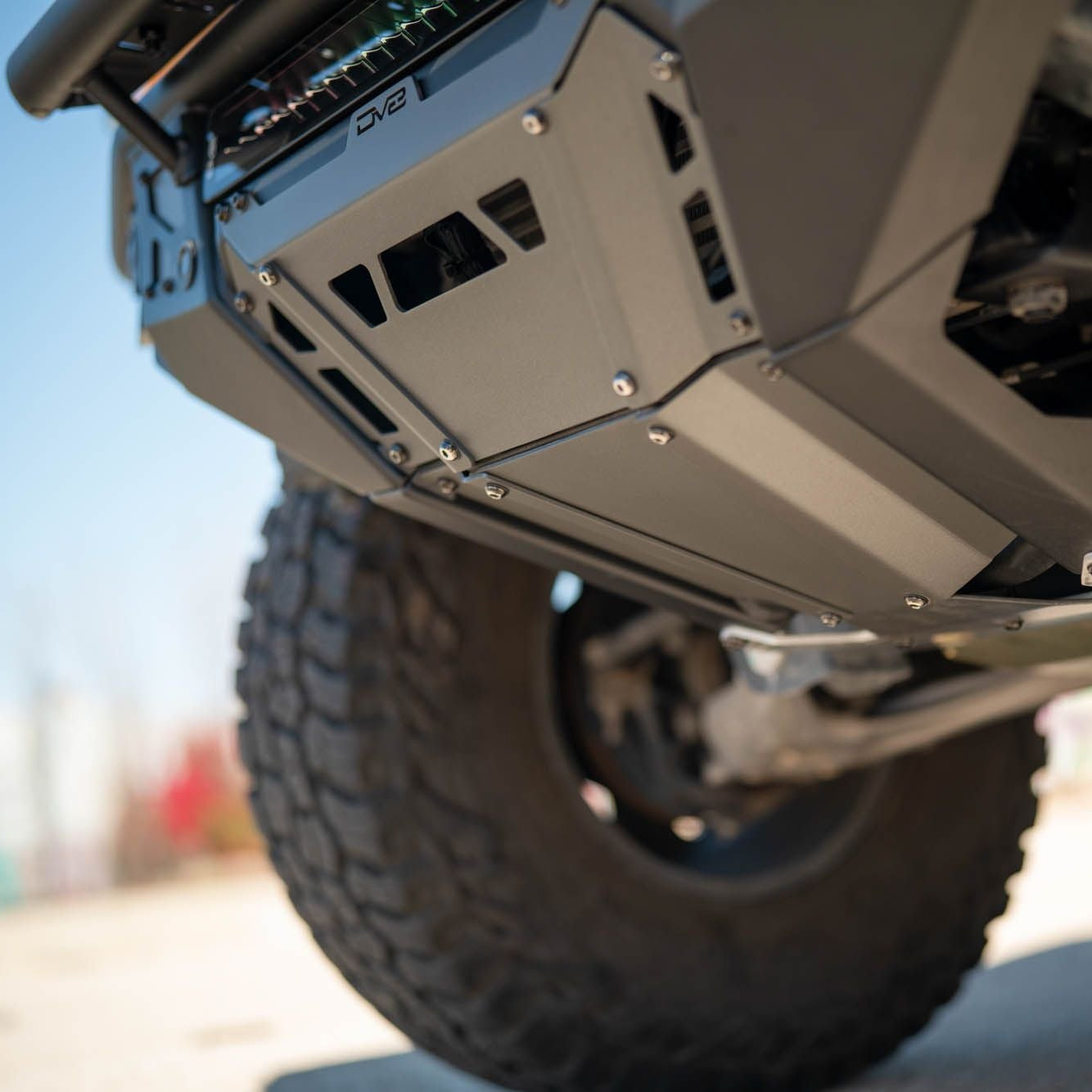 DV8 Offroad FBBR-08 Tube Series front bumper skid plate underside detail installed on Ford Bronco