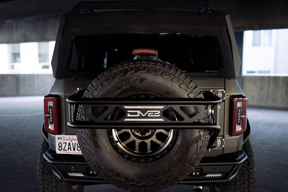 2021-2026 Ford Bronco Spare Tire Guard and Accessory Mount | DV8 Offroad