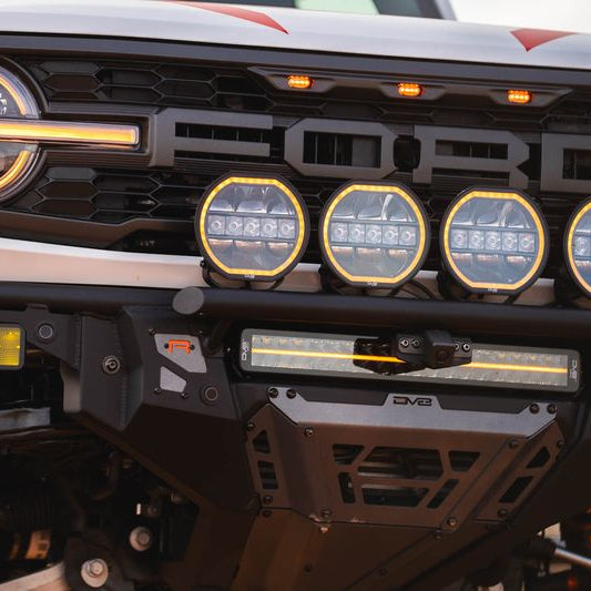 DV8 Offroad Tube Series front bumper installed on white Ford Bronco Raptor with LED light bar and round lights – front view