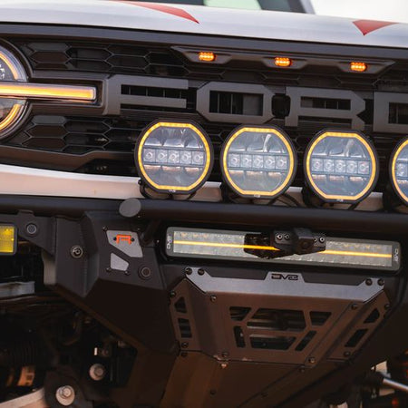 DV8 Offroad Tube Series front bumper installed on white Ford Bronco Raptor with LED light bar and round lights – front view