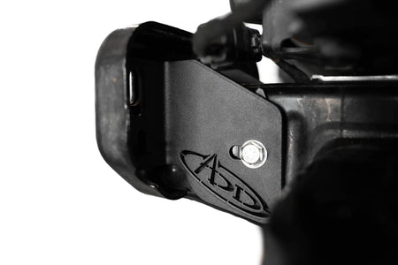 Addictive Desert Designs frame horn gusset installed on Ford Bronco frame, close-up showing ADD logo and mounting bolt