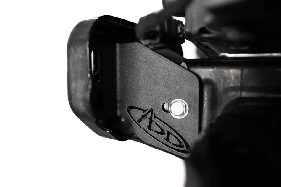 Addictive Desert Designs frame horn gusset installed on Ford Bronco frame, close-up showing ADD logo and mounting bolt
