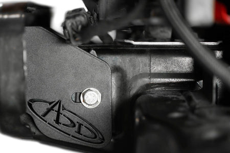 Addictive Desert Designs frame horn gusset installed on Ford Bronco frame, close-up showing bracket and wiring near undercarriage