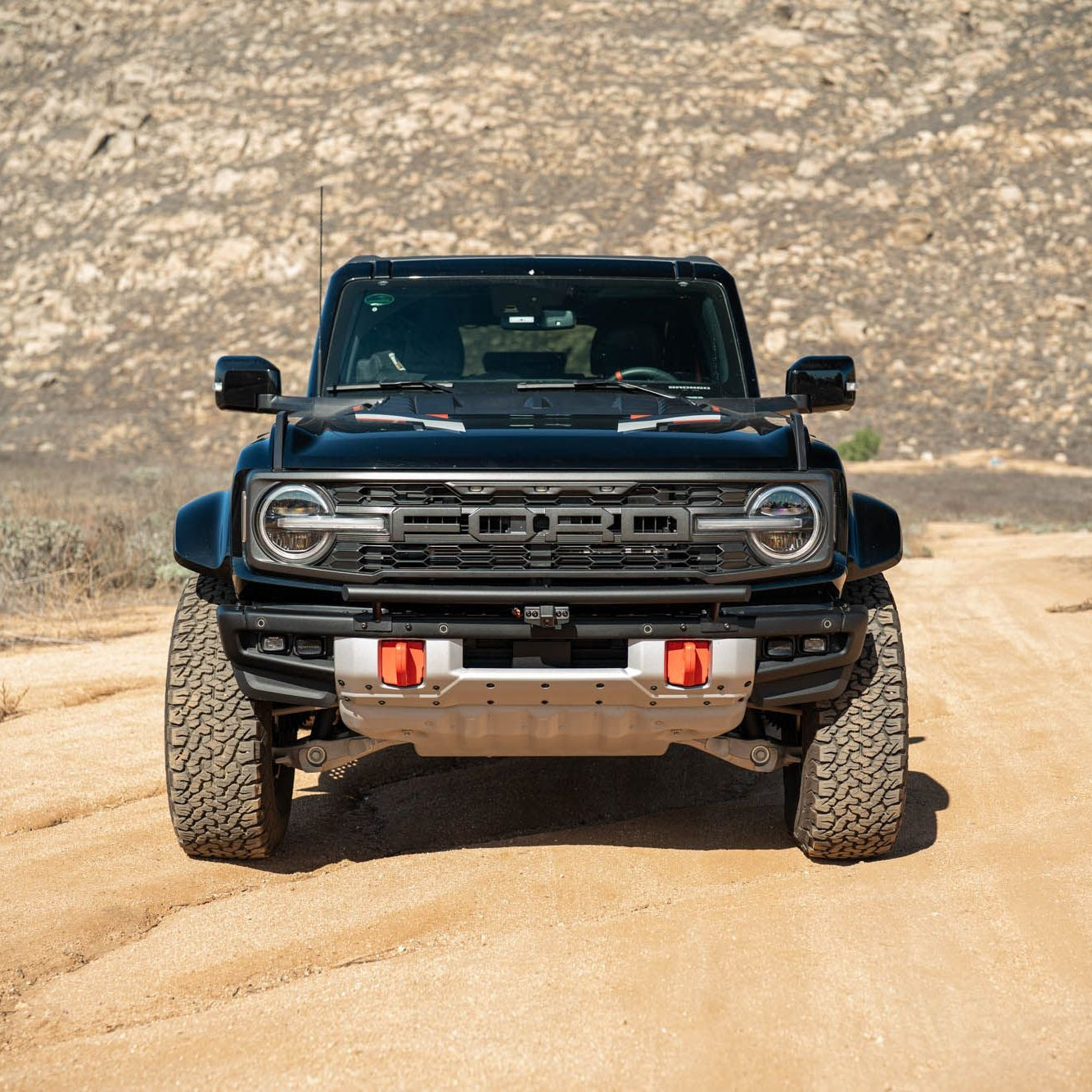DV8 Offroad LBBR-10 Tube Push Bar installed on dark gray Ford Bronco – front view desert terrain
