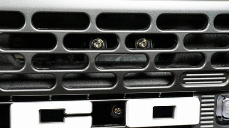 Close-up of a Bronco grille with a metallic finish