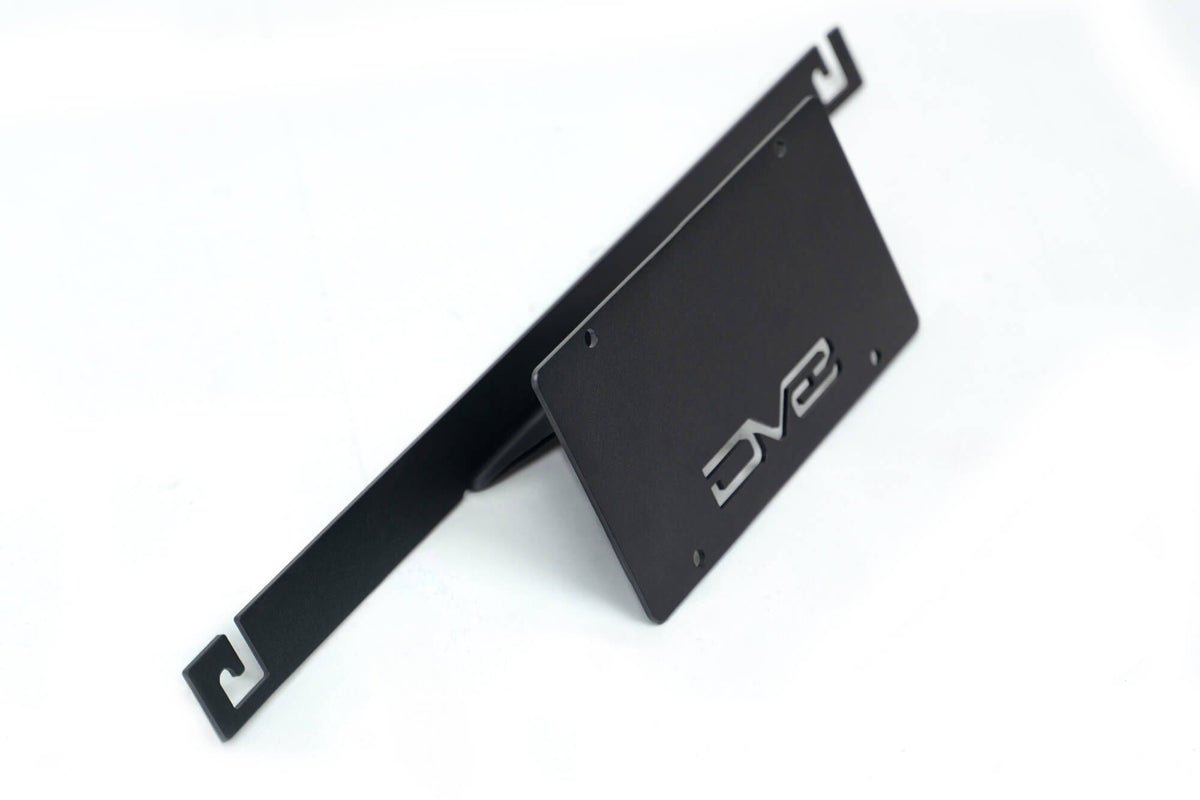 DV8 Offroad license plate mount 3/4 angle view showing bracket arm and mounting structure