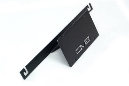 DV8 Offroad license plate mount 3/4 angle view showing bracket arm and mounting structure