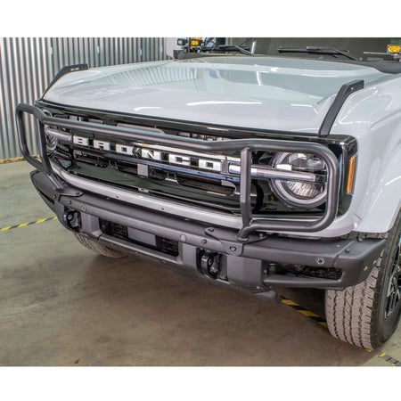 Turn Offroad modular bumper grille guard installed on white Ford Bronco, straight-on close-up in shop setting
