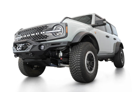 Addictive Desert Designs Krawler front bumper installed on gray Ford Bronco, front three-quarter view of full vehicle, product shot on white background, alternate angle