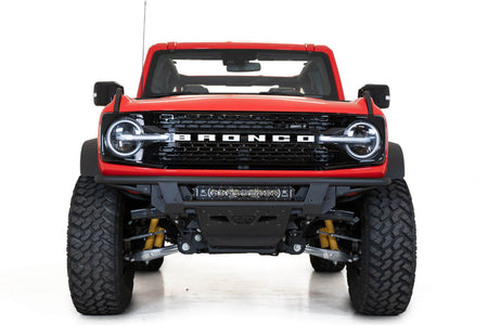 Addictive Desert Designs PRO Bolt-On front bumper installed on red Ford Bronco, straight-on front view product shot on white background, alternate angle