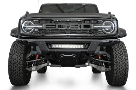 Addictive Desert Designs Phantom front bumper installed on black Ford Bronco Raptor, straight-on front view, product shot on white background