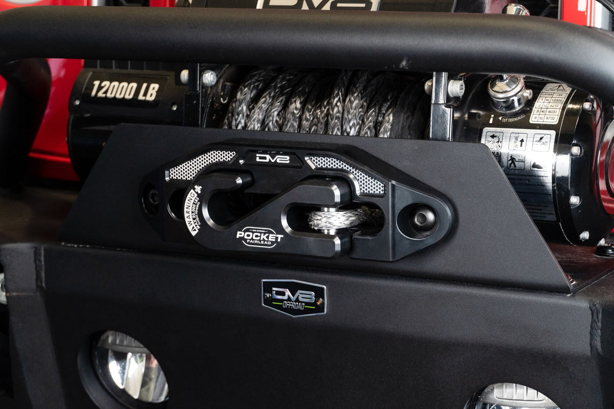 Pocket fairlead equipped on the front of a vehicle with a bull bar slightly visible