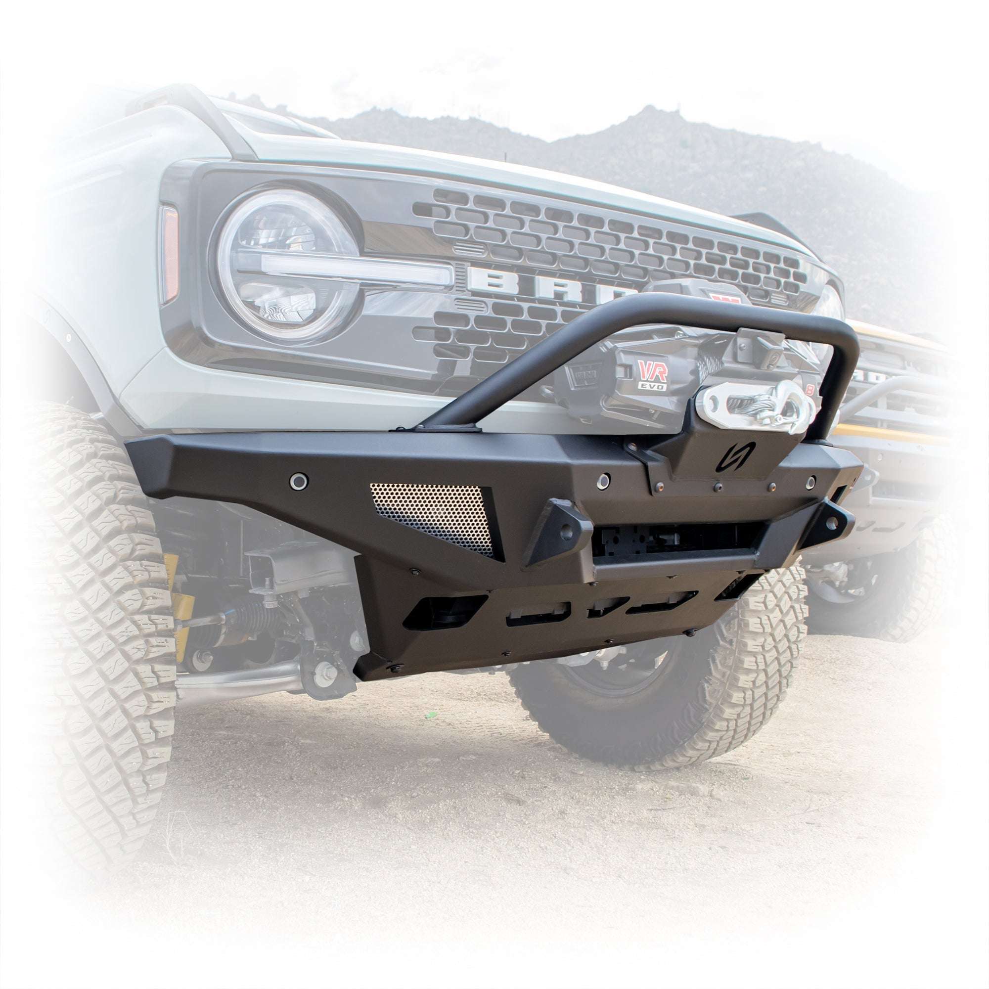 Turn Offroad winch front bumper package installed on white Ford Bronco, close-up front three-quarter view showing bull bar and winch mount