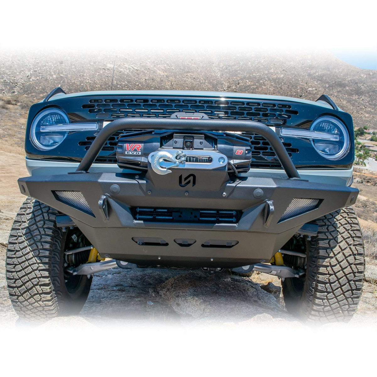 Turn Offroad winch front bumper package installed on Ford Bronco, straight-on close-up showing winch and bull bar