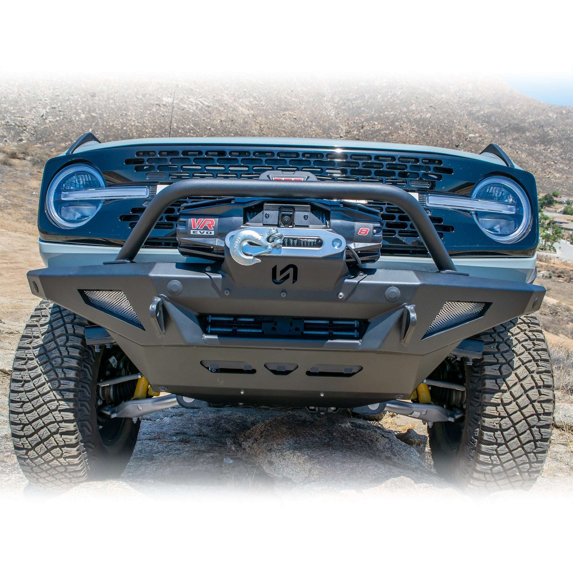 Turn Offroad winch front bumper package installed on Ford Bronco, straight-on close-up showing winch and bull bar