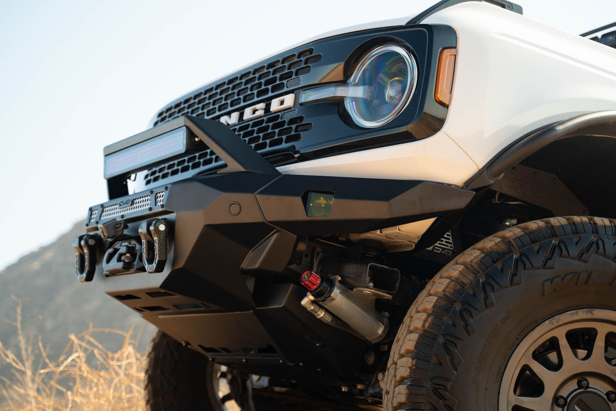 DV8 Offroad FBBR-07 MTO V2 front bumper installed on white Ford Bronco – close-up front view showing bull bar