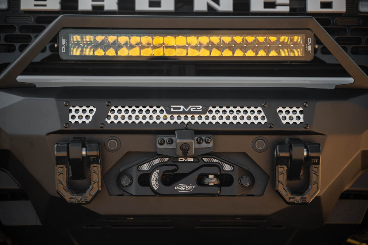 DV8 Offroad FBBR-07 MTO V2 front bumper installed on dark Ford Bronco showing LED light bar – front view