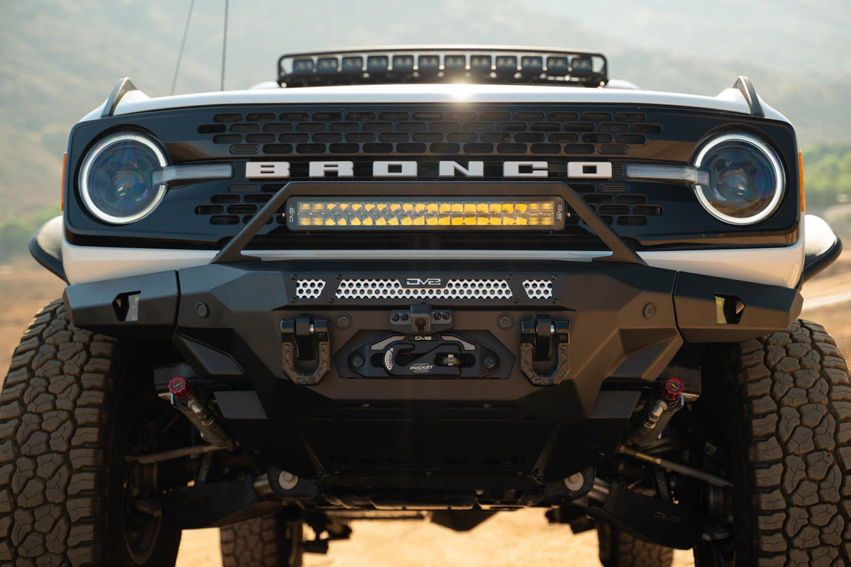 DV8 Offroad FBBR-07 MTO V2 front bumper installed on white Ford Bronco with round lights – front view