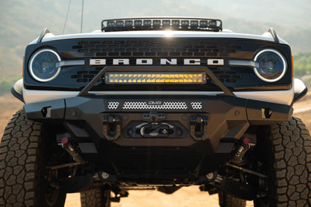 DV8 Offroad FBBR-07 MTO V2 front bumper installed on white Ford Bronco with round lights – front view