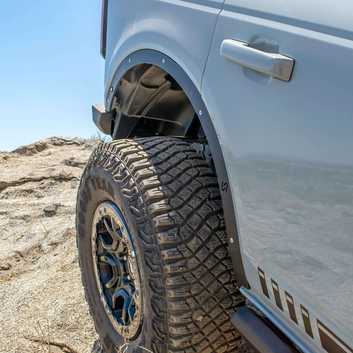 Turn Offroad fender delete kit installed on Ford Bronco, close-up front wheel well and delete panel