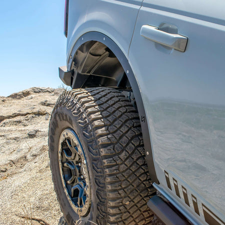 Turn Offroad fender delete kit installed on Ford Bronco, close-up front wheel well and delete panel