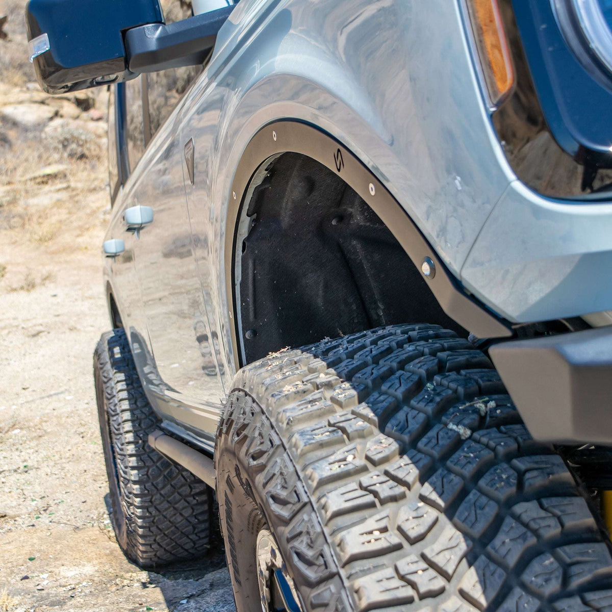 Turn Offroad fender delete kit installed on Ford Bronco, close-up rear quarter panel showing delete panel and wheel