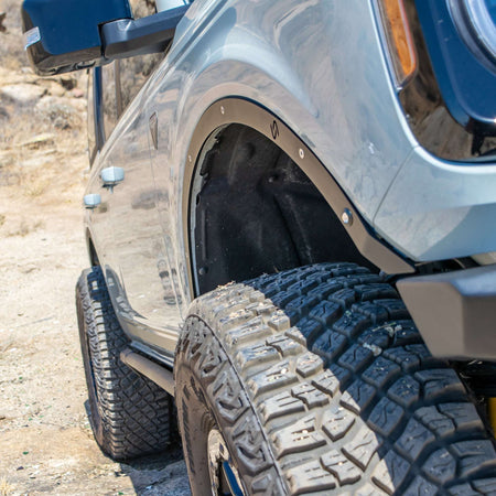 Turn Offroad fender delete kit installed on Ford Bronco, close-up rear quarter panel showing delete panel and wheel