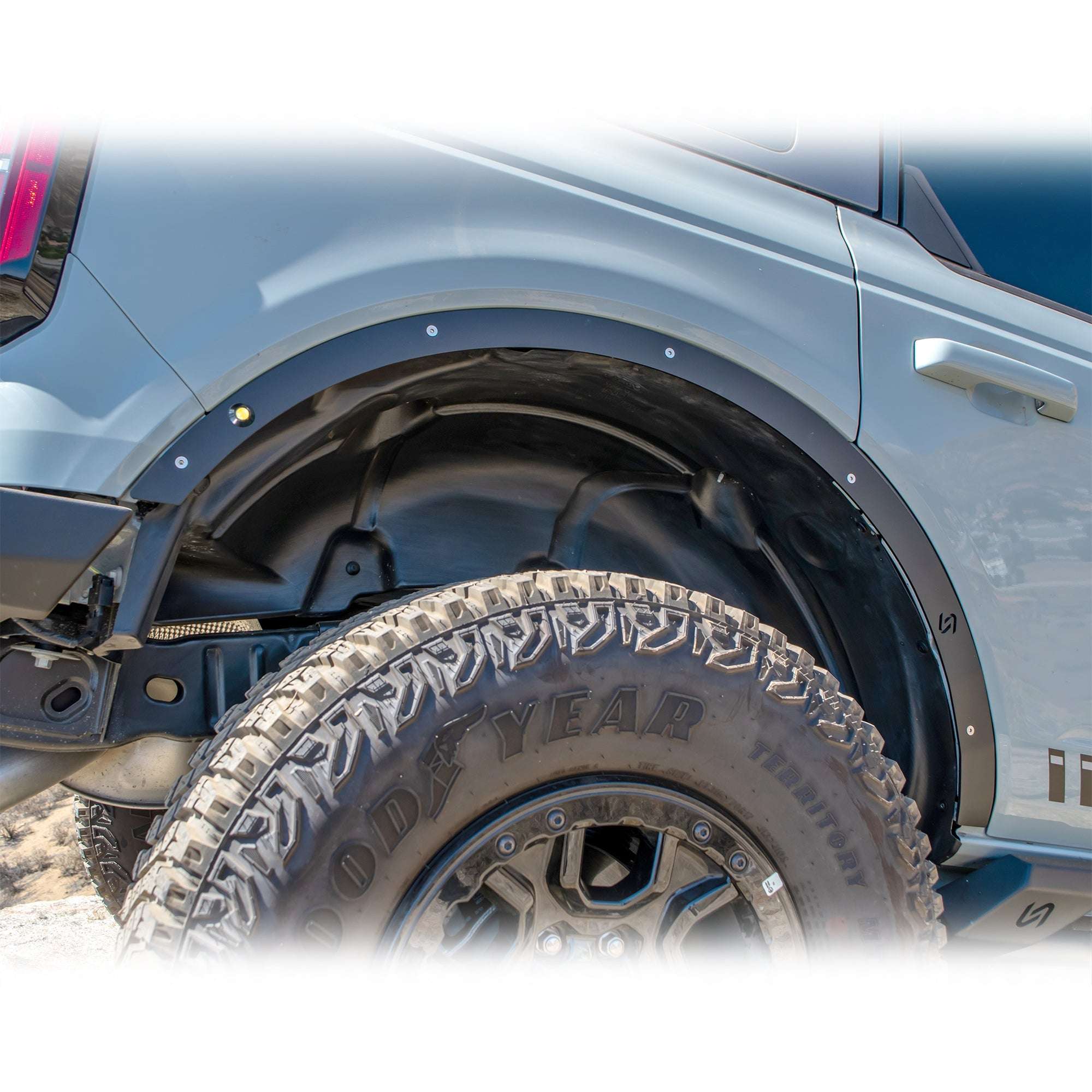 Turn Offroad fender delete kit installed on Ford Bronco, close-up rear quarter panel and wheel