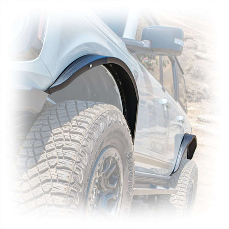Turn Offroad steel fender flares installed on Ford Bronco, close-up rear fender and tire on rocky trail