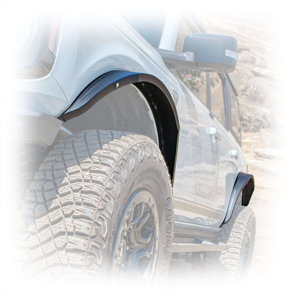 Turn Offroad steel fender flares installed on Ford Bronco, close-up rear fender and tire on rocky trail