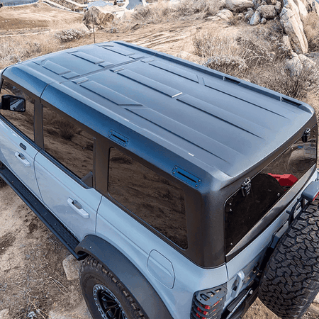 Turn Offroad TR10 hard top installed on white 4-door Ford Bronco, top-down view showing roof panel and rear hatch