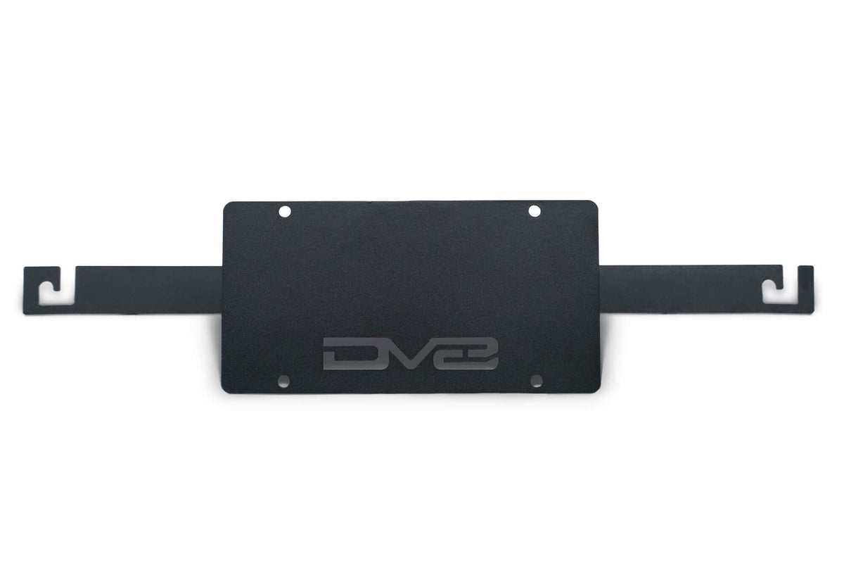 DV8 Offroad flat license plate mount black powder coat product shot showing full bracket assembly for 2021-2026 Ford Bronco Capable Steel Bumper