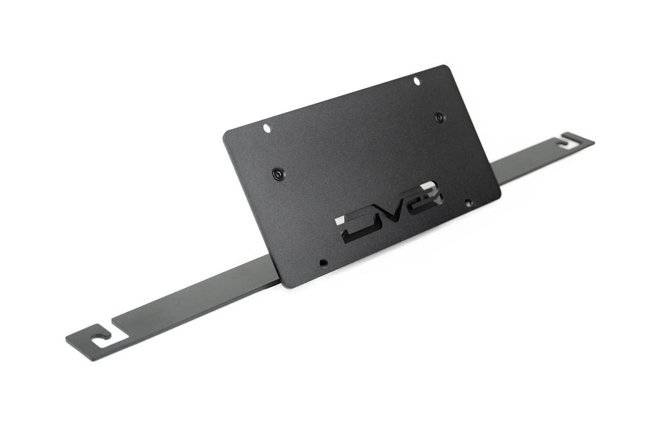 DV8 Offroad slanted license plate mount detail shot showing angled arm and DV8 logo cutout