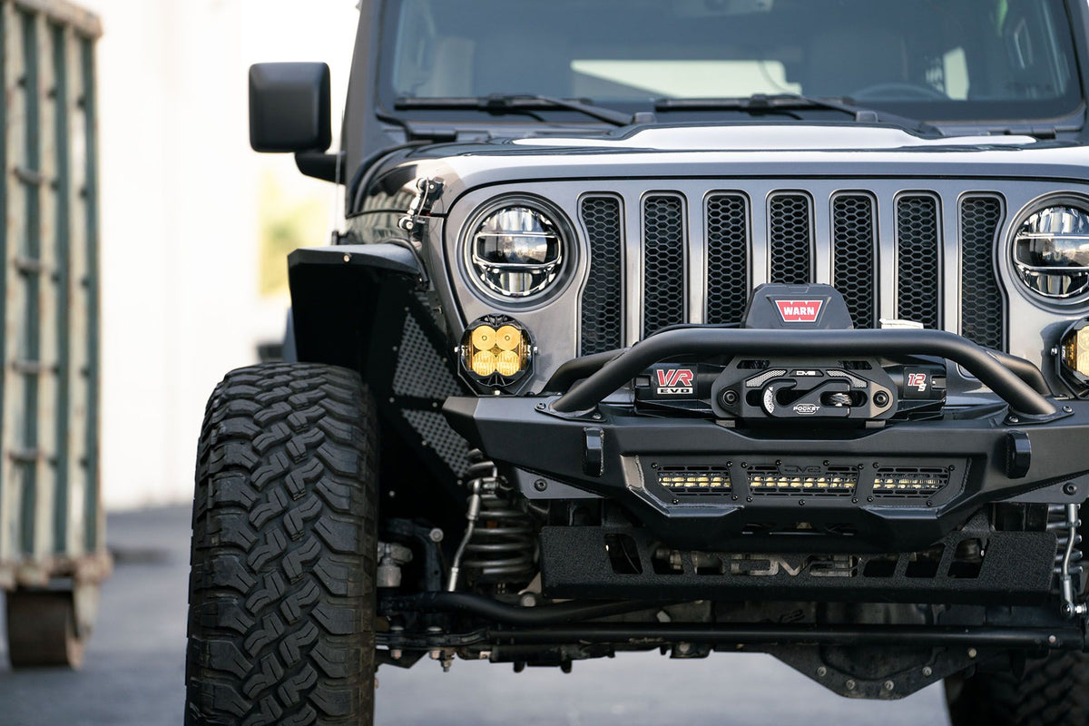 Front view of a Jeep with off-road accessories on a blurred background