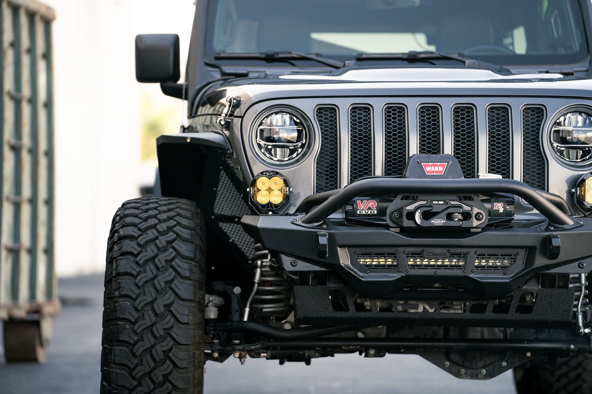 Front view of a Jeep with off-road accessories on a blurred background