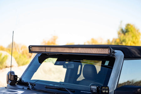 DV8 Offroad 52-inch straight light bar mount installed on 2021-2026 Ford Bronco 3/4 front view