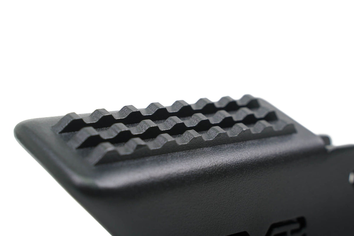 DV8 Offroad foot peg close-up top view showing full grip surface texture detail