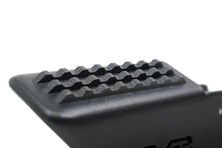 DV8 Offroad foot peg close-up top view showing full grip surface texture detail