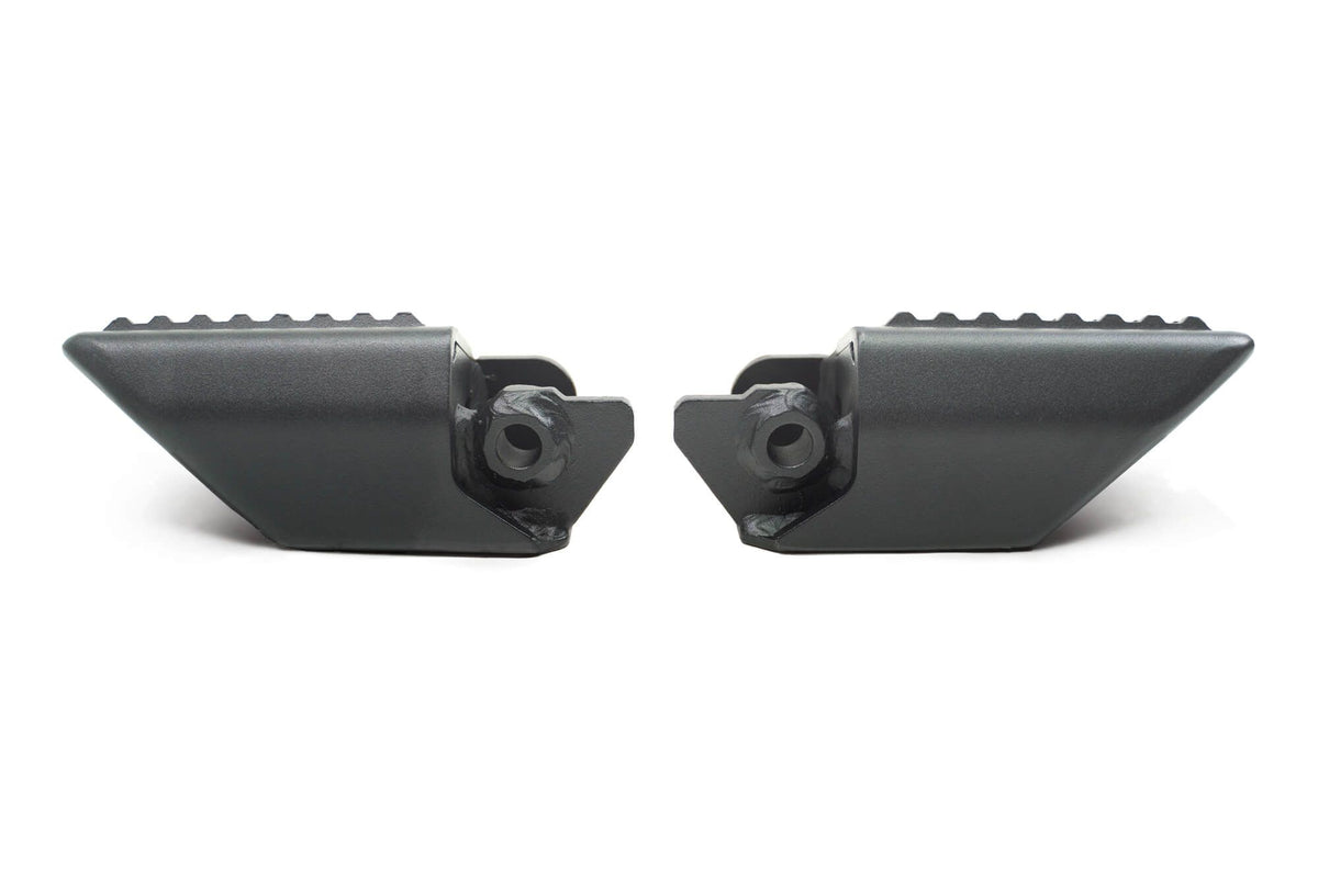 DV8 Offroad foot pegs top-down 3/4 view showing both pegs and textured grip surface