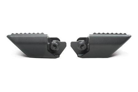 DV8 Offroad foot pegs top-down 3/4 view showing both pegs and textured grip surface