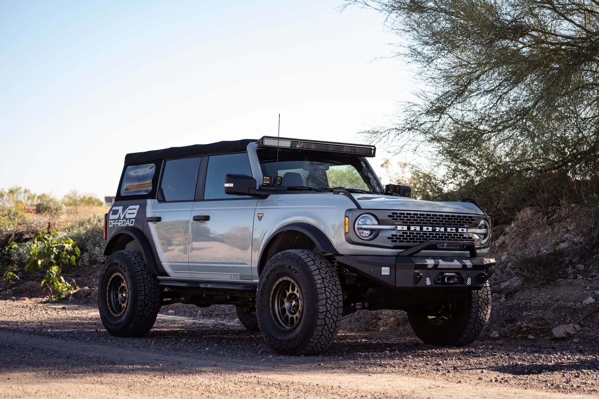 DV8 Offroad 52-inch straight light bar mount installed on 2021-2026 Ford Bronco full front view showing complete setup