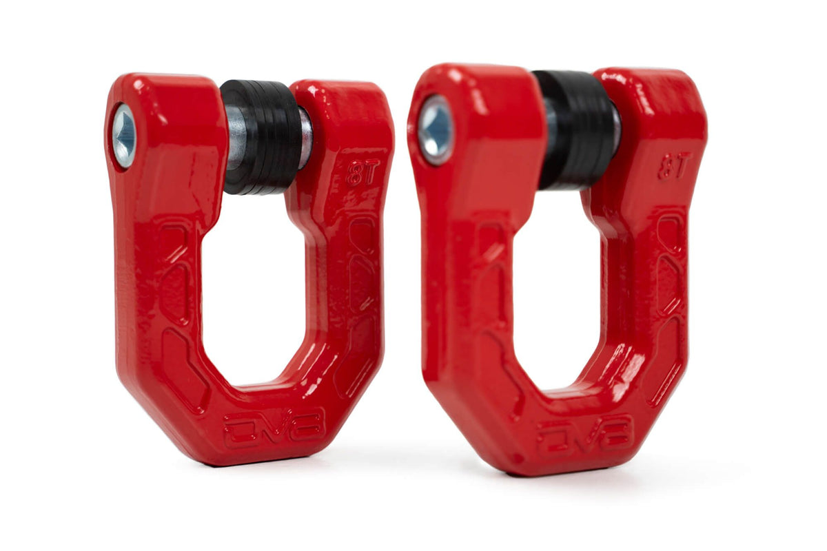 Two red D-ring shackles on a white background